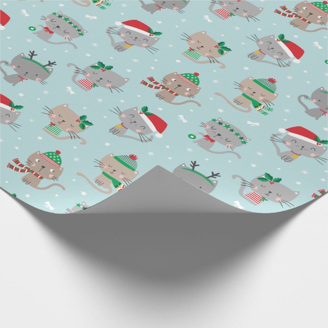 Niedliche Weihnachtskatzen auf hellblau Geschenkpapier (Ecke)