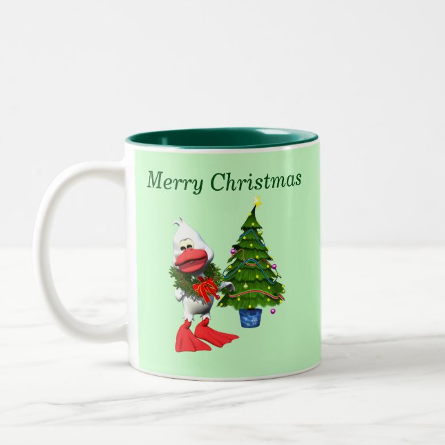 Niedliche weiße Weihnachtsente mit einem Kranz Zweifarbige Tasse (Links)
