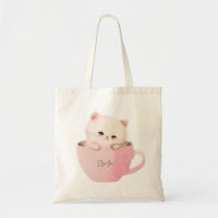 Niedliche weißrosa Katze im Teecup