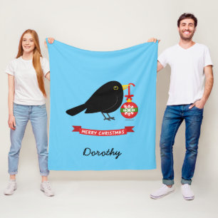 Niedlicher Blackbird mit einem Weihnachtsball-Indi Fleecedecke