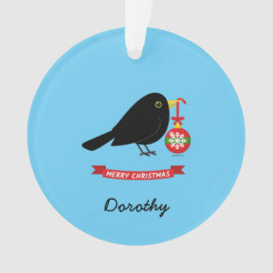 Niedlicher Blackbird mit einem Weihnachtsball-Indi Ornament