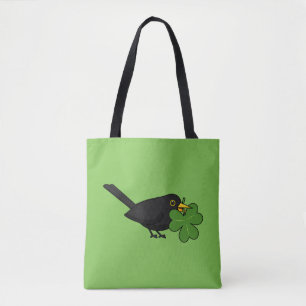 Niedlicher Blackbird mit Kleeblatt Clou Cartoon