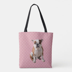 Niedlicher Bulldog mit rosa Polka Dots Hintergrund