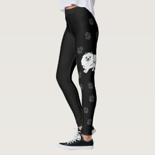 Niedlicher Cartoon-Hund aus weißem Spitz mit schwa Leggings