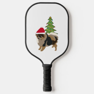 Niedlicher Cartoon Sable-Spitz in einer Weihnachts Pickleball Schläger