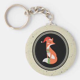 Niedlicher Fox in Weihnachtshut in einem schwarzen Schlüsselanhänger