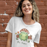 Niedlicher Frosch und Pilze aus Mohn Cartoon T-Shirt<br><div class="desc">Dieser niedliche T - Shirt mit einem handgezeichnet Kawaii-Cartoon-Frosch, der einen Pilzhut trägt, zusammen mit anderen Pilzen, einer Schnecke, einer Blume, einem Schmetterling und Gras. Ein Farbschema aus Rot, Limon, Grün, Braun, Orange, Gelb und Pfirsich ist perfekt für Indie oder Hütte Core Ästhetik Liebhaber. Passen Sie den Text auf Wunsch...</div>