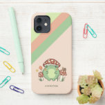 Niedlicher Frosch und Pilze Cartoon | Name iPhone 12 Hülle<br><div class="desc">Dieser niedliche Handykoffer ist mit einem handgezeichnet kawaii-artigen Cartoon-Frosch ausgestattet, der einen Pilzhut trägt, zusammen mit anderen Pilzen, einer Schnecke, einer Blume, einem Schmetterling und Gras. Ein Farbschema aus Rot, Limon, Grün, Braun, Orange, Gelb und Pfirsich ist perfekt für Indie oder Hütte Core Ästhetik Liebhaber. Eine Textvorlage ist für die...</div>
