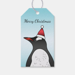 Niedlicher Gentoo Pinguin mit einer Weihnachtsmann Geschenkanhänger