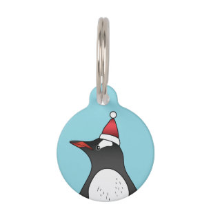 Niedlicher Gentoo Pinguin mit einer Weihnachtsmann Haustiermarke