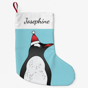 Niedlicher Gentoo Pinguin mit einer Weihnachtsmann Kleiner Weihnachtsstrumpf