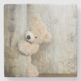 Niedlicher gepolsterter Bär Rustikale Holzwand Steinuntersetzer