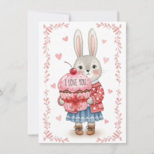 Niedlicher Hase hält rosa Cupcake Feiertagskarte