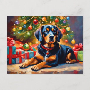 Niedlicher Hund am Weihnachtsbaum Feiertagspostkarte