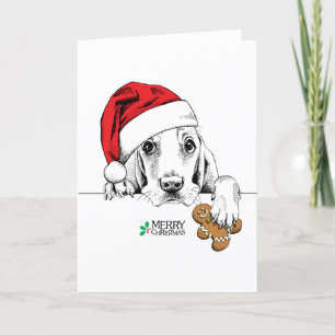 Niedlicher Hund mit Gingerbread Mann Keks Feiertagskarte