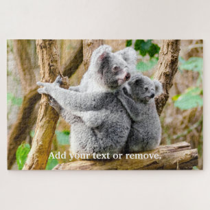 Niedlicher Koala-Bär und Baby sitzen auf Eukalypyu Puzzle