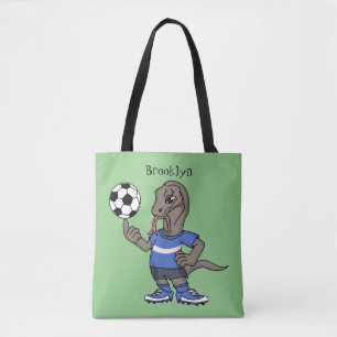 Niedlicher Komodo-Drache beim Fußballspielen Carto