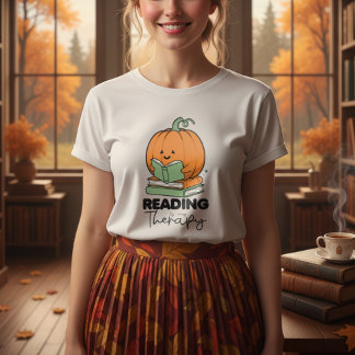 Niedlicher Kürbis, der ein Buch hält, im Herbst le T-Shirt