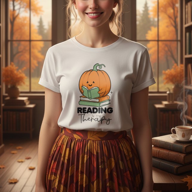 Niedlicher Kürbis, der ein Buch hält, im Herbst le T-Shirt (Von Creator hochgeladen)
