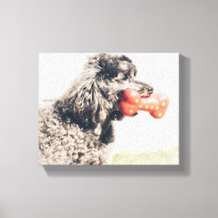 Niedlicher Poodle-Hund mit Spielzeugknochen Leinwanddruck
