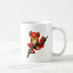 Niedlicher roter Baum-Frosch auf einer Kaffeetasse