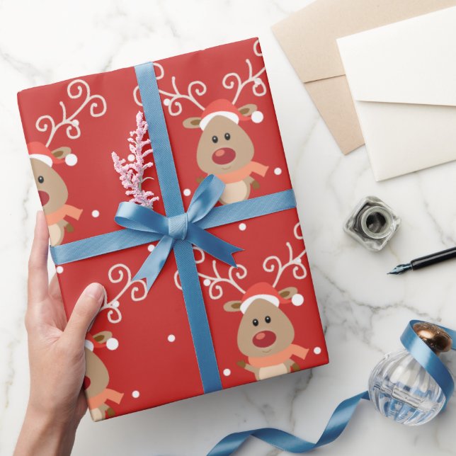 Niedlicher Rudolph der Cartoon der Rentiere mit ro Geschenkpapier (Schenken)