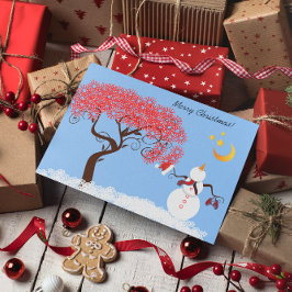 Niedlicher Schneemann mit Blick auf den Mond Feiertagskarte