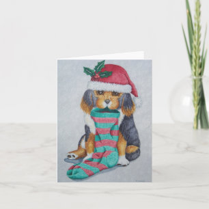 niedlicher, schwarz-brauner Welpe mit Weihnachtswe Feiertagskarte