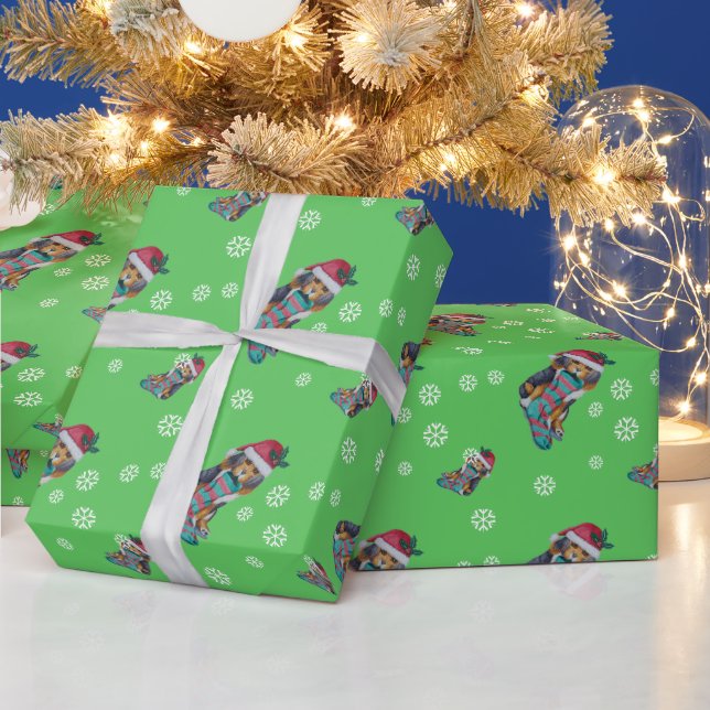 niedlicher, schwarz-brauner Welpe, zu Weihnachten  Geschenkpapier (Feiertage)