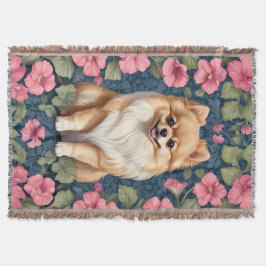 Niedlicher Spitz Hund mit rosa Petunias Decke