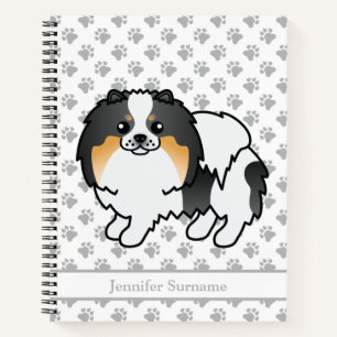 Niedlicher Spitz mit weißem Tricolor und benutzerd Notizbuch