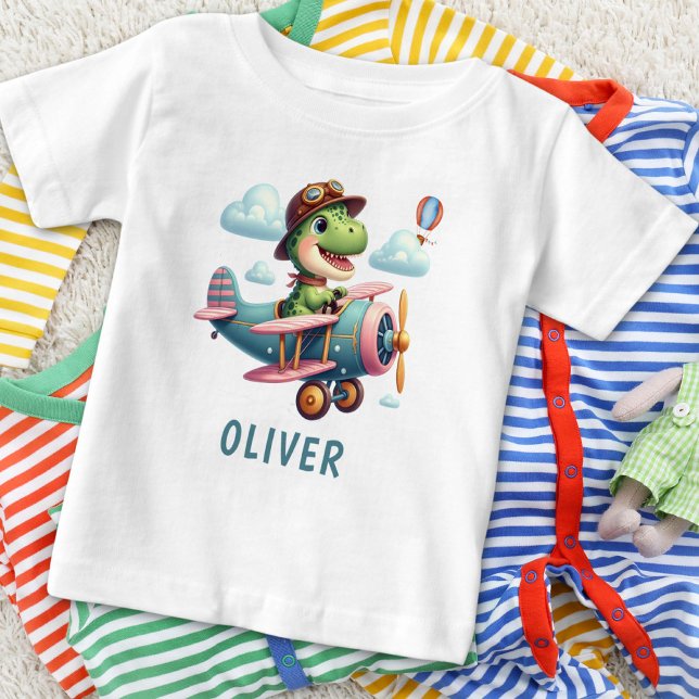 Niedlicher Trex Dinosaurier mit einem charmanten F Baby T-shirt (Von Creator hochgeladen)