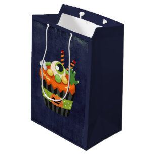 Niedlicher und grauenhafter Halloween Cupcake mit Mittlere Geschenktüte