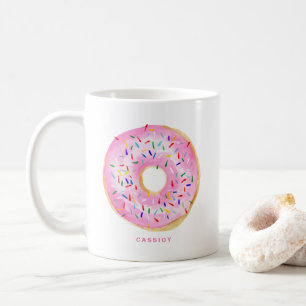 Niedlicher Watercolor-Rosa-Krapfen besprüht Kaffeetasse