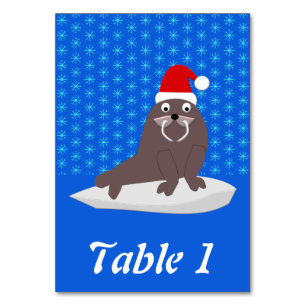 Niedlicher Weihnachtswalrus und Schneeflocken Tischnummer