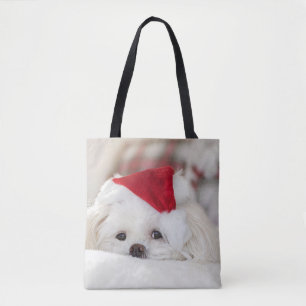 Niedlicher Weißhund in einem Red Christmas Hat
