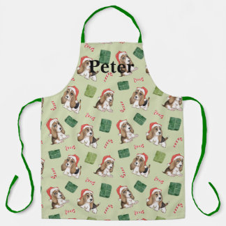 Niedlicher Welpe mit seiner Weihnachtsmannmütze-Sc Schürze