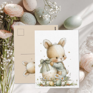 Niedliches Babykaninchen in Schlafanzug mit einem Postkarte