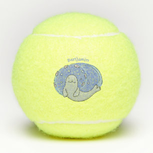 Niedliches glückliches Siegel und Cartoon in Fisch Tennisbälle