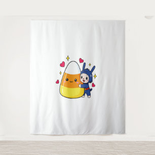 Niedliches Kaninchen umarmt Candy Corn Wandteppich