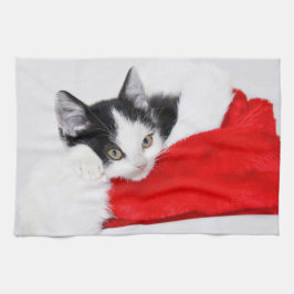Niedliches Kätzchen in der Weihnachtsmannmütze Geschirrtuch