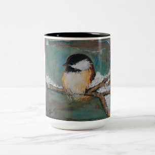 Niedliches Winterschwarzes mit einer Kappe Zweifarbige Tasse