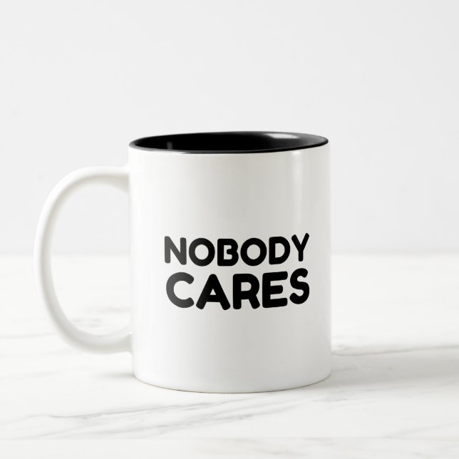 NIEMAND CARS ZWEIFARBIGE TASSE (Links)