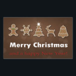 Noble Weihnachtsgebäck Rechteckiger Aufkleber<br><div class="desc">Elegante und köstliche Weihnachtsabbild: dekorierter Lebkuchenmann,  Lebkuchenschneeflocke,  Lebkuchenweihweihnachtsbaum,  Lebkuchenrentiere und Lebkuchengebäck mit einem fröhlichen Weihnachtsgrüßen auf braunem Bukahintergrund.</div>