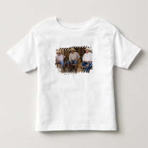 Nordamerika, USA. Cowboys entspannen sich und Kleinkind T-shirt