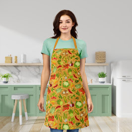 Nudeln und farbiges Gemüse, orange Schürze