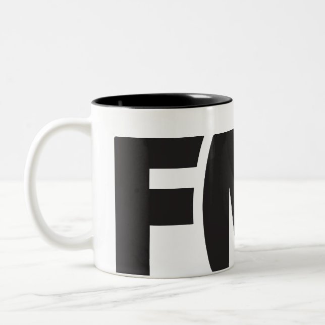 Offizielle FML Tasse: FML Logo (Schwarzes) Zweifarbige Tasse (Links)