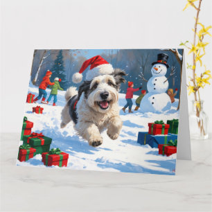 Old English Sheepdog läuft im Schnee mit Weihnacht Karte