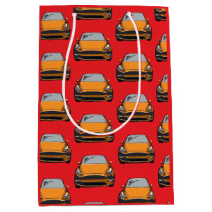 Orange Electric Vehicle SUV Car Red Background Mittlere Geschenktüte
