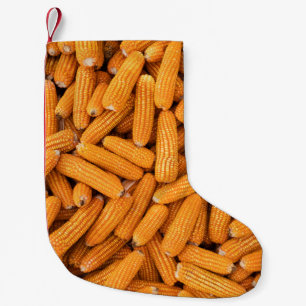 Orange Mais Cob: Ernte Landwirtschaft Hintergrund Kleiner Weihnachtsstrumpf